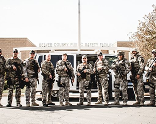 Police Staff in Front of Vehicle